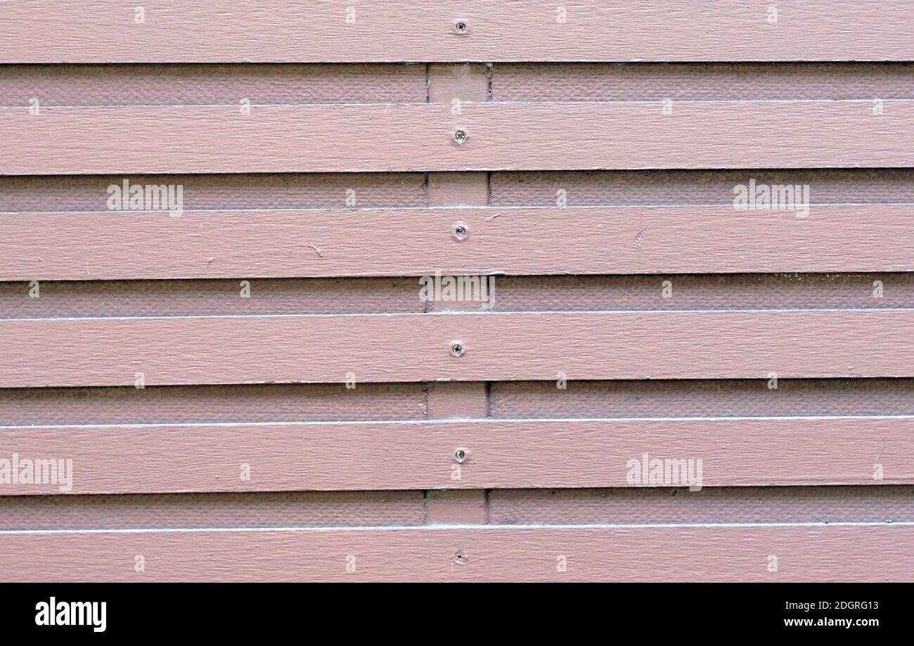 A soft magenta holizontal fence by hardwood style. Stock Photo
