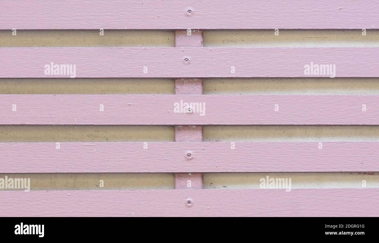 A soft magenta holizontal fence by hardwood style. Stock Photo