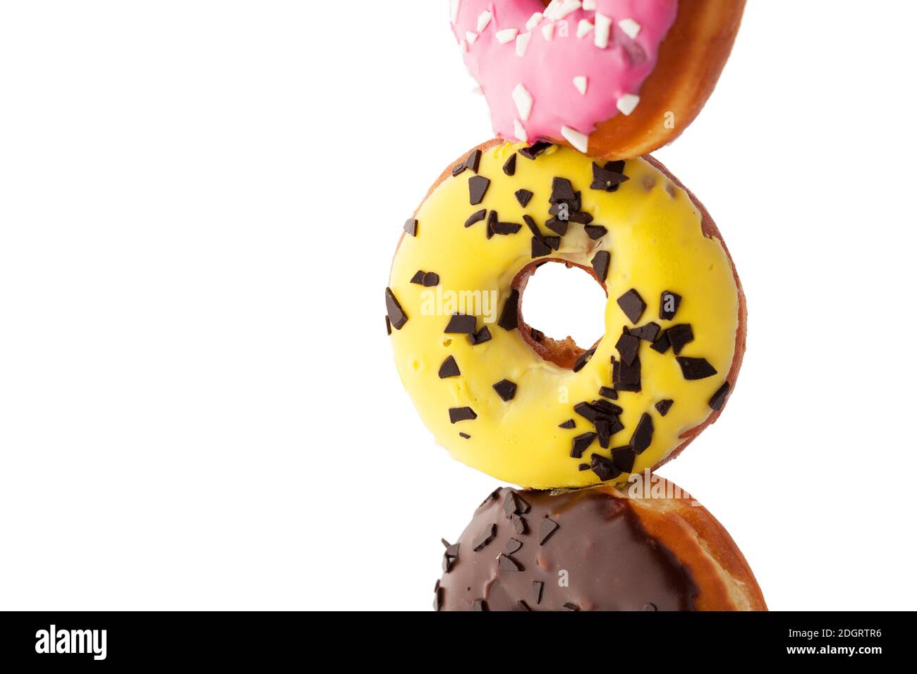 Assortment of donuts with different glaze isolated on white background. Stock Photo
