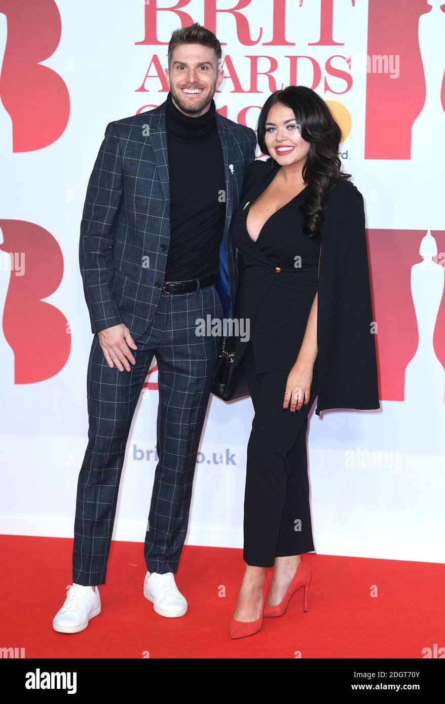 Joel Dommett and Scarlett Moffatt attending the Brit Awards at the O2 Arena, London. Photo credit should read: Doug Peters/EMPICS Entertainment EDITORIAL USE ONLY Stock Photo