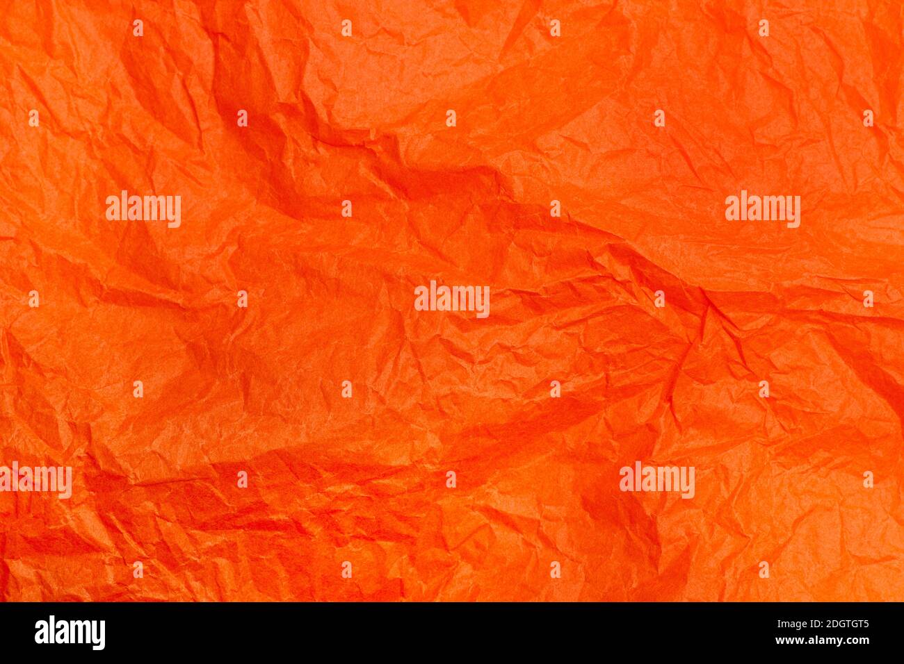 Orange wrinkled paper in a close up view Stock Photo - Alamy