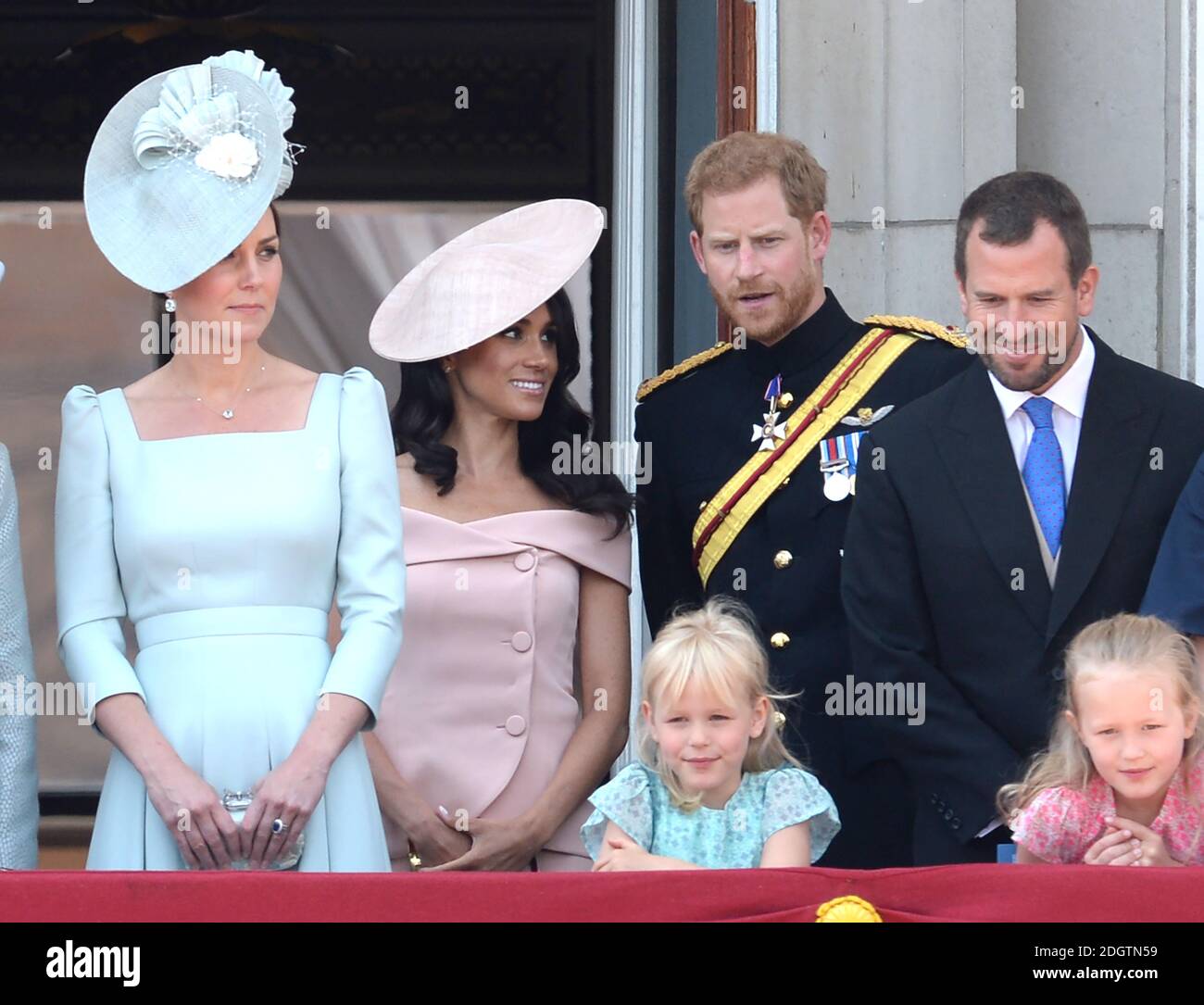 Prince Harry, Meghan Duchess of Sussex, Catherine Duchess of Cambridge and Peter Phillips on the balcony of Buckingham Palace at Trooping The Colour, London. Photo credit should read: Doug Peters/EMPICS Stock Photo