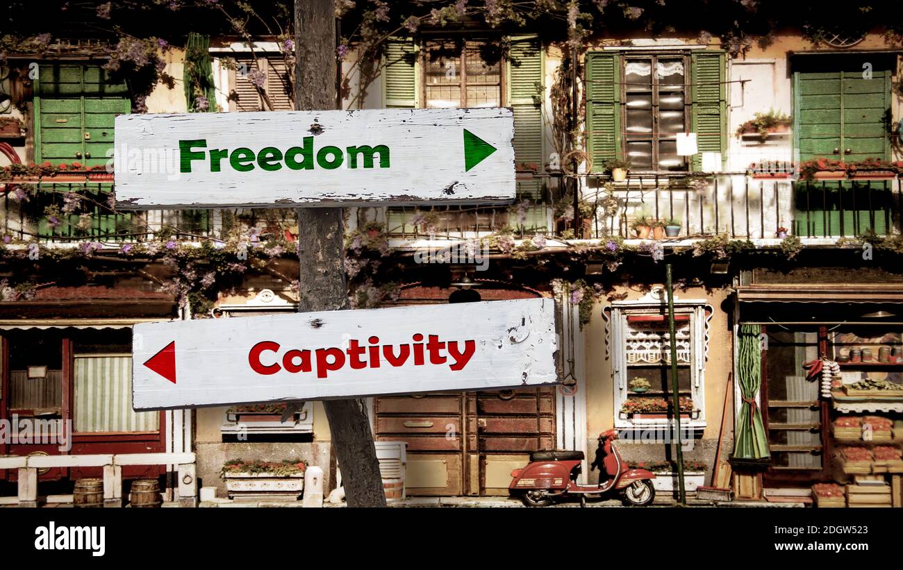 Street Sign to Freedom versus Captivity Stock Photo - Alamy