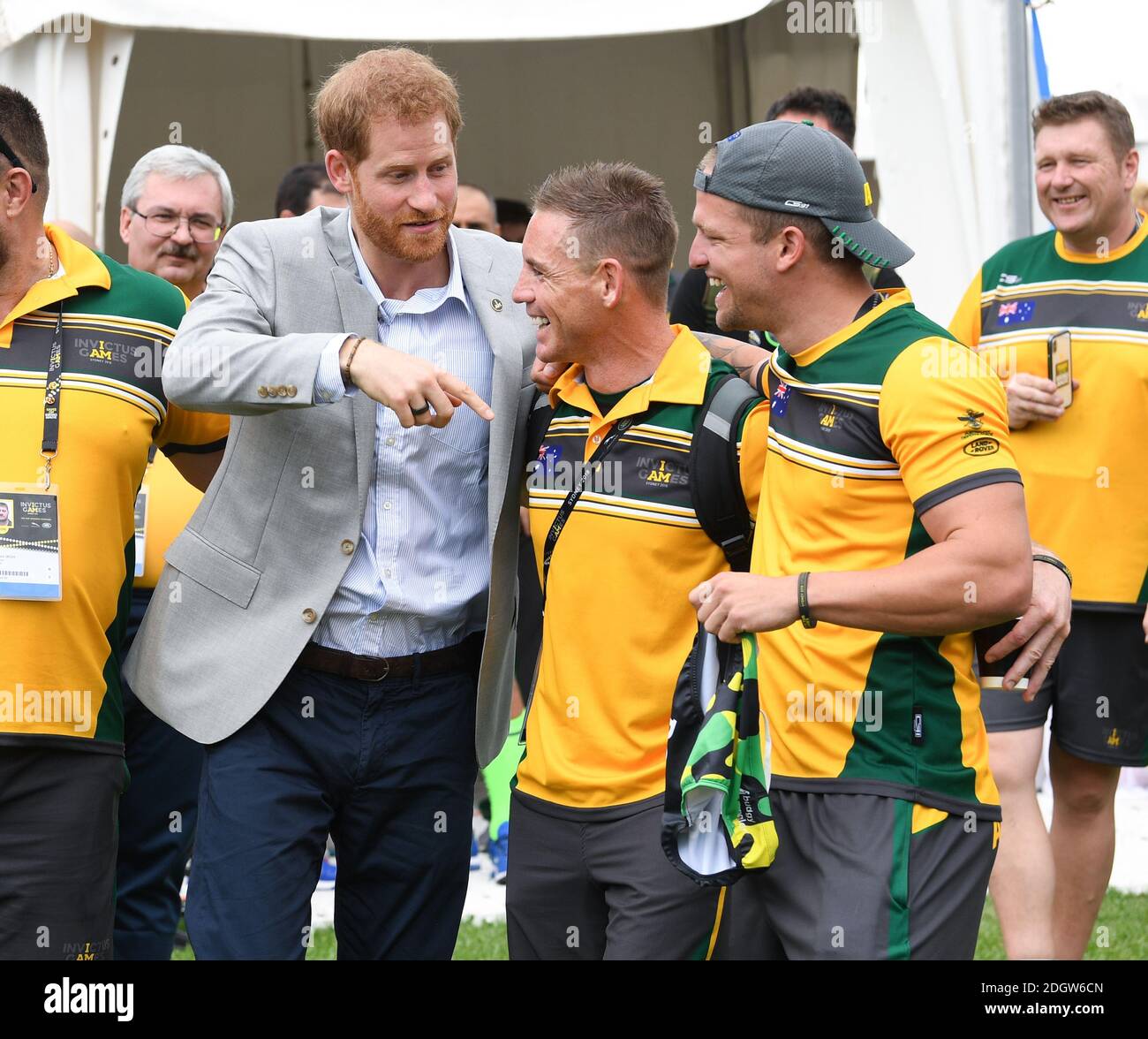 Prince Harry Duke of Sussex meets athletes at  the Invictus Games and joined a medal presentation. He was presented with a pair of Budgie Smuggler swimming trunks by the Australian athletes. The Duchess of Sussex who was due to be there pulled out of the event due to be tired and needing rest ahead of the rest of the Royal Tour, the Botanic Gardens, Sydney. Photo credit should read: Doug Peters/EMPICS Stock Photo