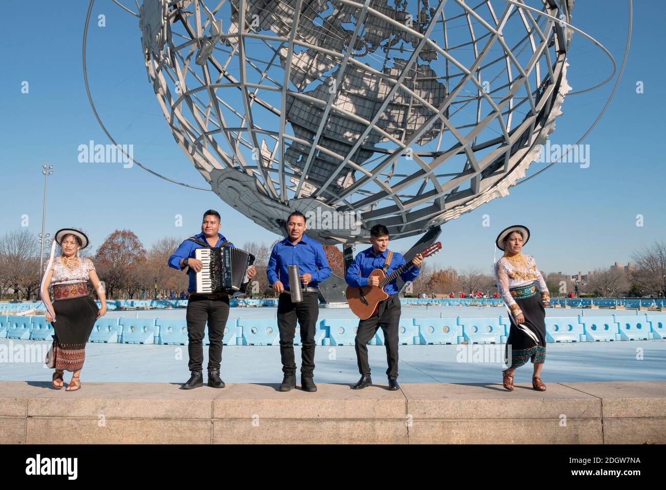 Ecuadorian musicians and dancers perform during the making of a video. At the Unisphere in Flushing Meadows, Corona Park in Queens, New York City. Stock Photo