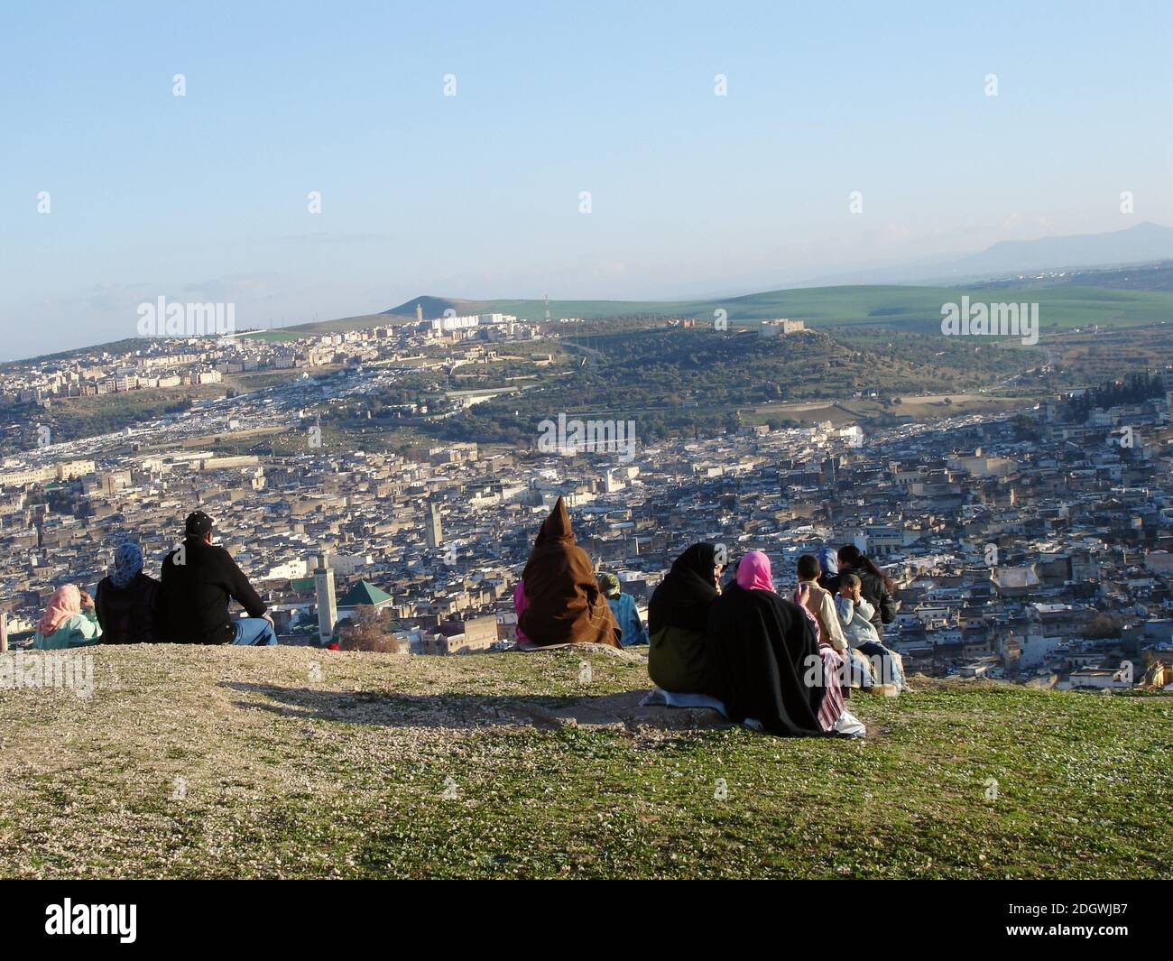 Fes, seen from outside the city walls while listening to the call to prayer    drift in waves from the mosques below. Stock Photo