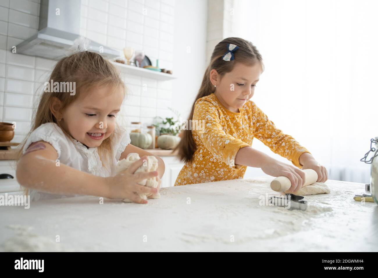 Image result for happy sisters children girls bake cookies, knead dough, play with flour ...