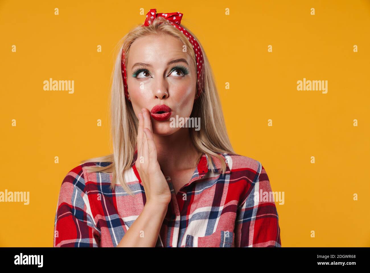 Image of surprised blonde pinup girl posing and looking upward isolated ...