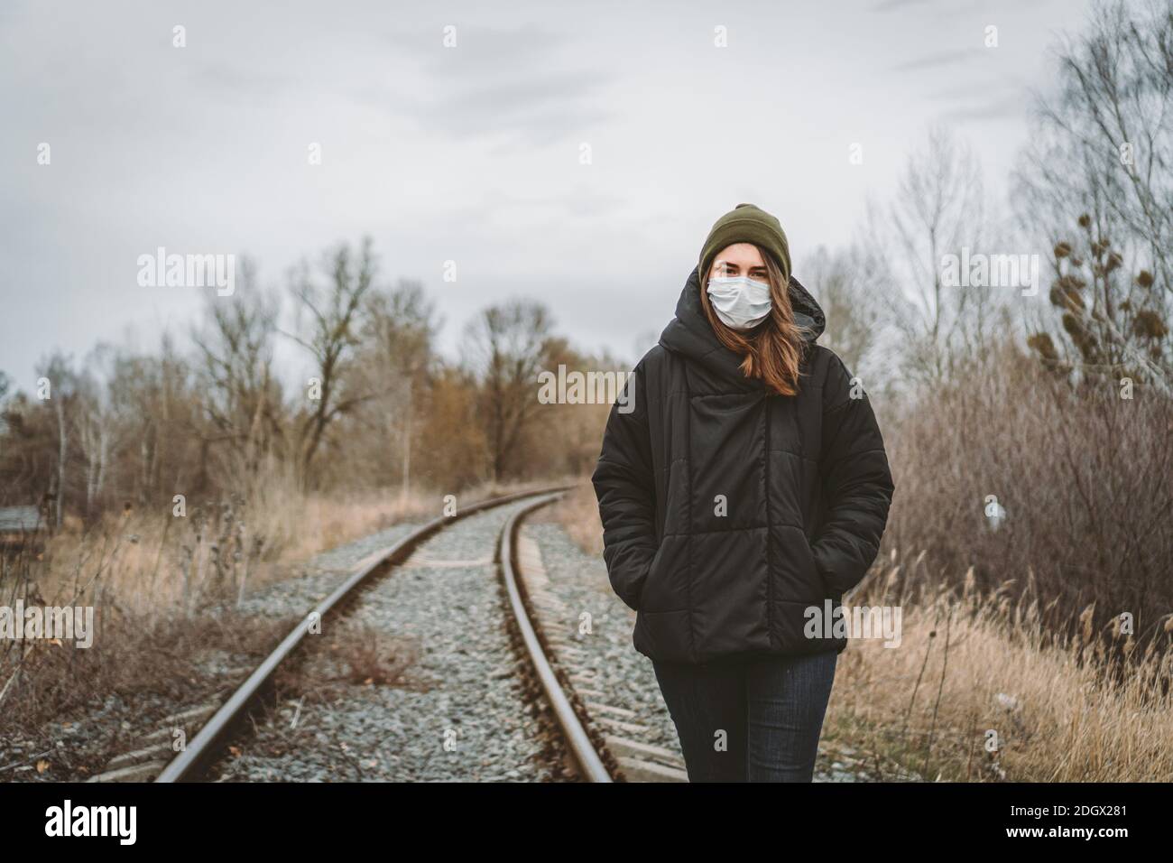 Portrait of young woman wearing medical mask, health protection from influenza virus, epidemic and infectious diseases. Protect Stock Photo