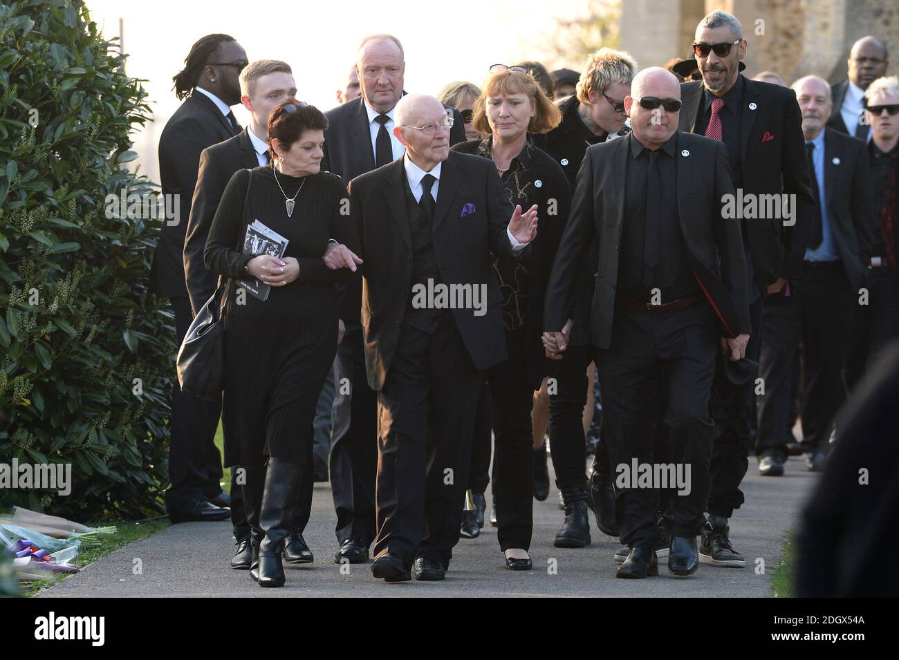 Keith Flint's dad Clive Flint (centre) outside St. Mary's Church during