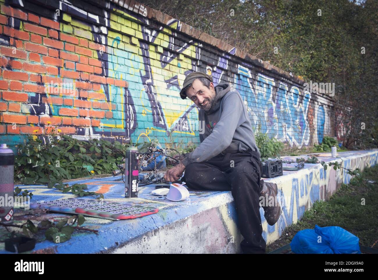 A local street artist and sculptor working outdoors in the Lea Valley, Hackney, London, UK Stock Photo