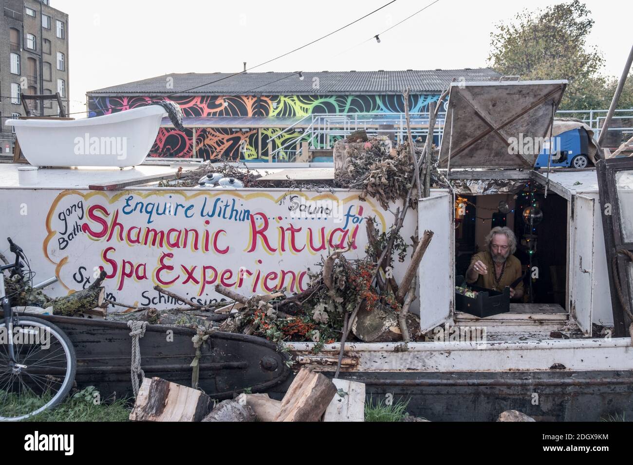 Local on his houseboat in Lea Valley, Hackney, poor housing, river boat