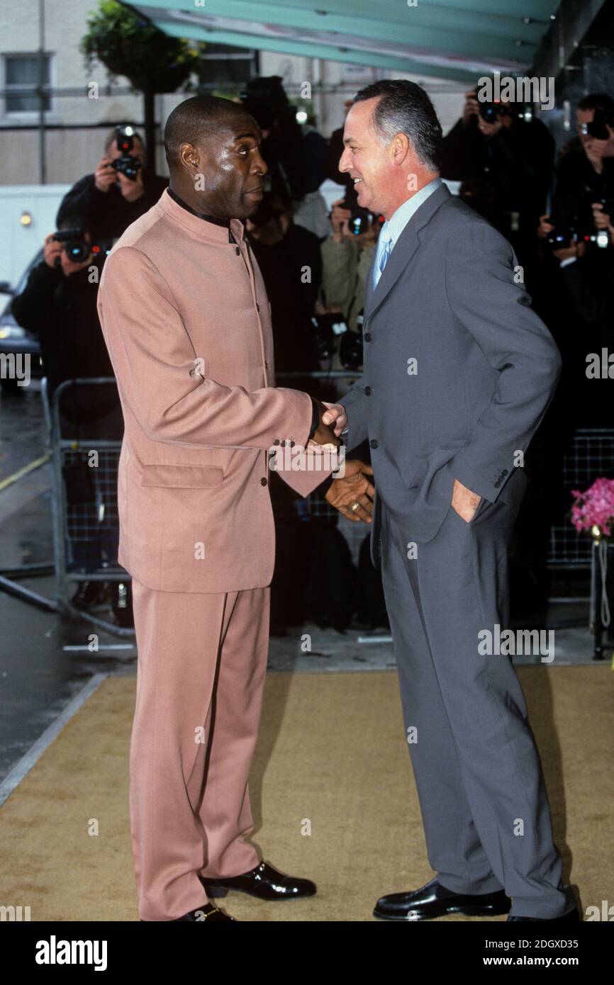 (L-R) Frank Bruno and Michael Barrymore shake hands Stock Photo