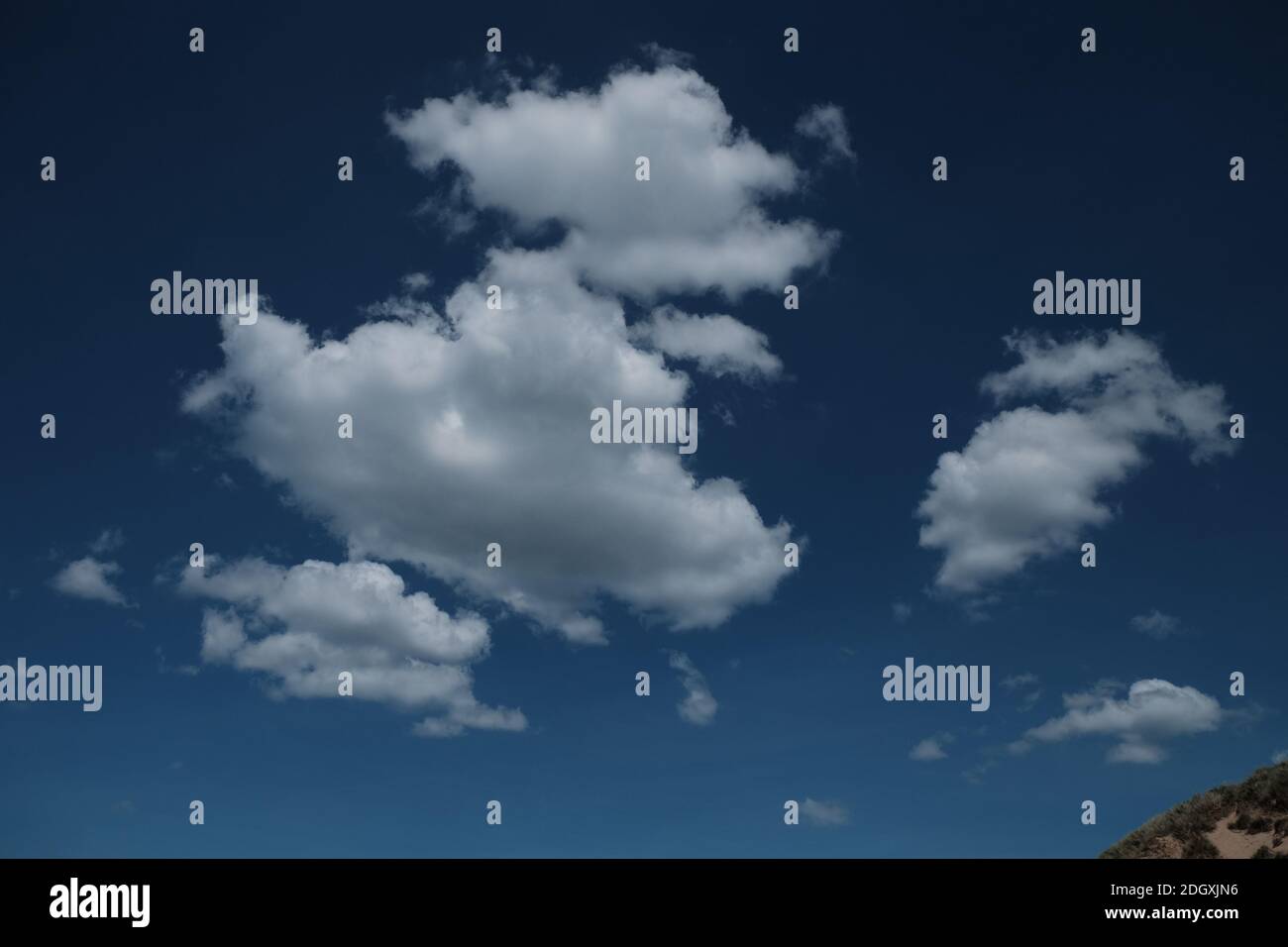 Defined white clouds on a deep blue sky Stock Photo