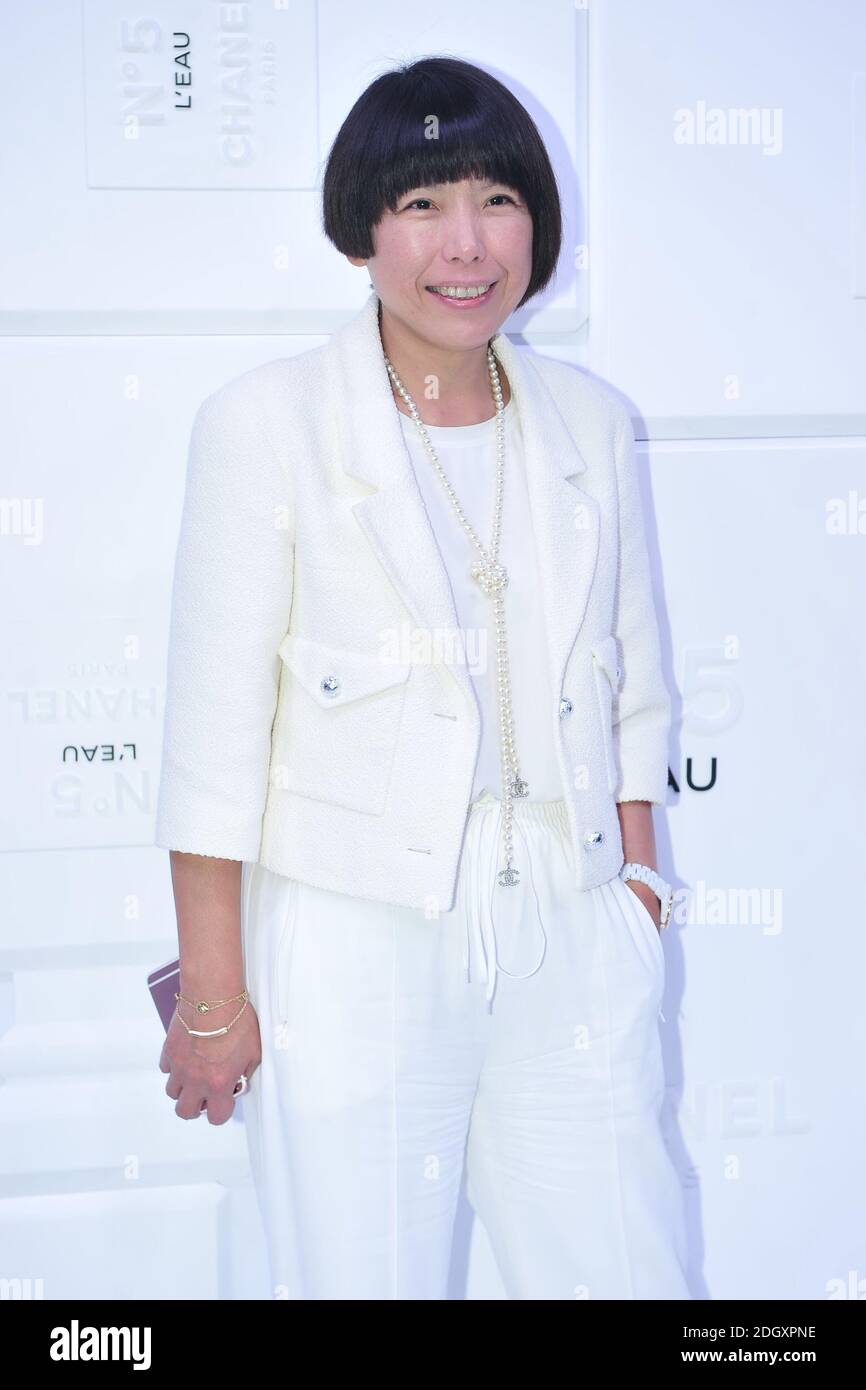 FILE--Angelica Cheung, also known in Chinese as Zhang Yu, shows up in white  suit at the launch of Chanel No.5 perfume in Beijing, China, 19 Septembe  Stock Photo - Alamy