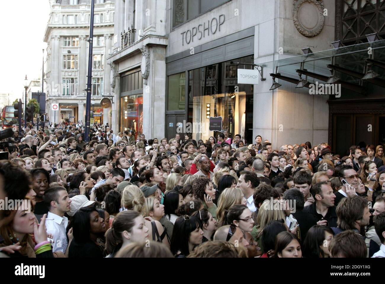 Customers wait to buy clothes from the new TopShop collection by Kate Moss  on the eve of her new collection being launched by the chain, at Oxford  Circus in London on April