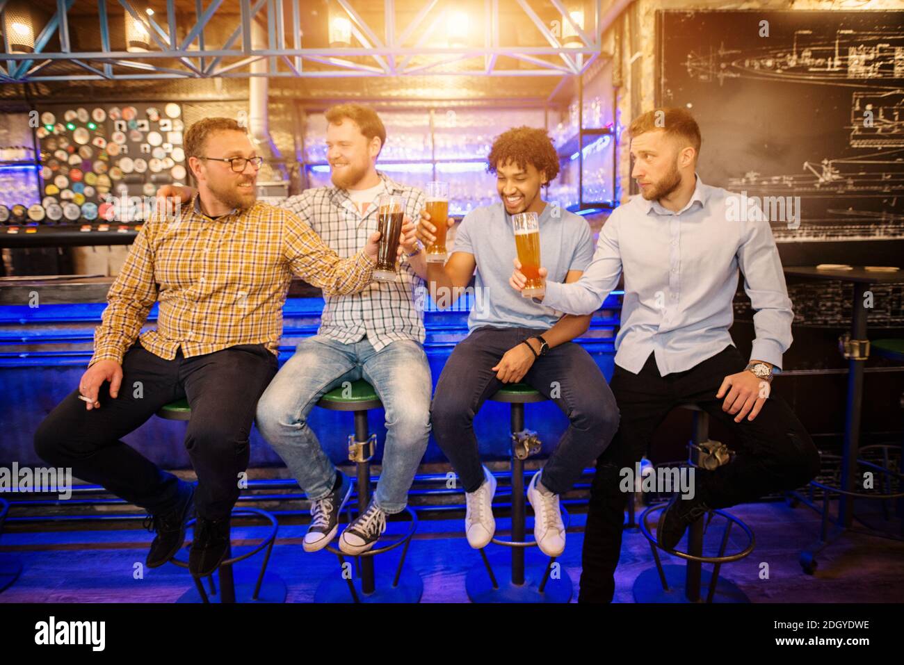 Sitting on bar stool hi-res stock photography and images - Alamy