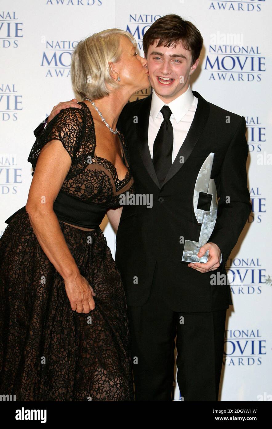 Daniel Radcliffe receives his award for Best Actor (for Harry Potter) from Dame Helen Mirren during The National Movie Awards at the Royal Festival Hall, central London. Stock Photo