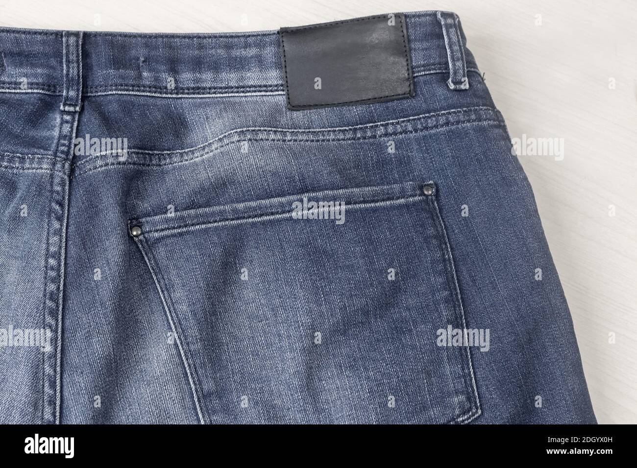 Denim trousers, fragment with a back 