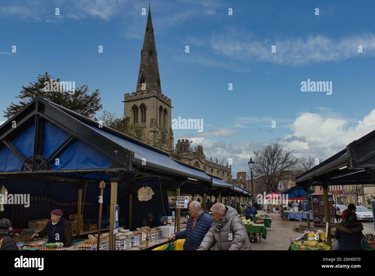 Bedford Market, Bedfordshire, UK. Elderly people shopping at fruit and