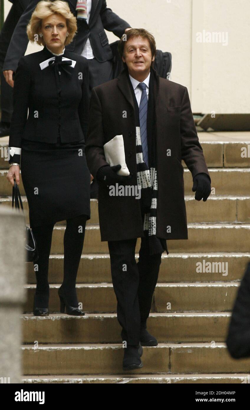 Sir Paul McCartney arrives at the High Court in London today, with members of his legal team including Fiona Shackleton (left) to hear the judgement on his divorce settlement with Heather Mills. Stock Photo