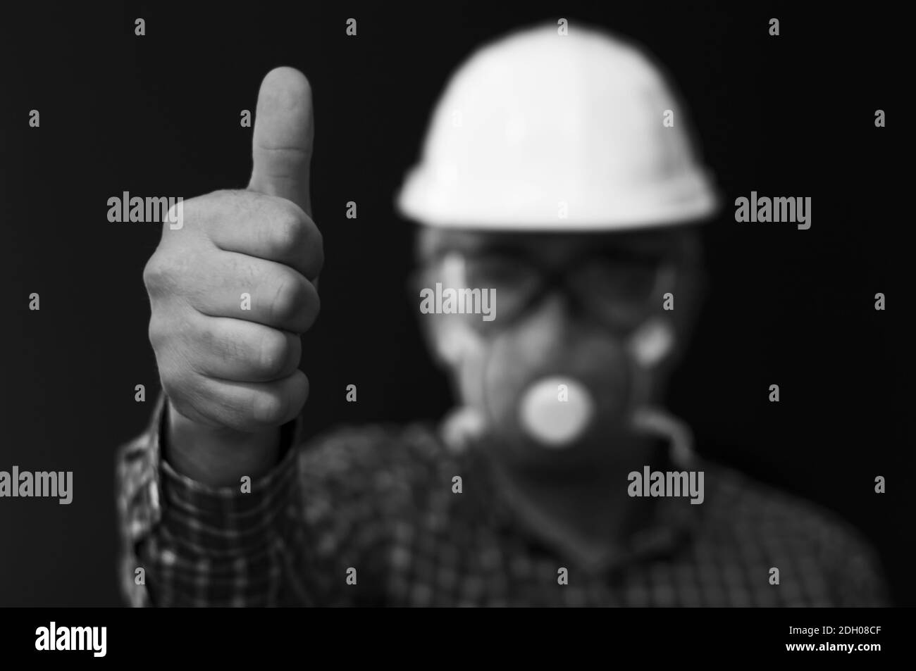 Positive emotion, worker shows thumbs up Stock Photo