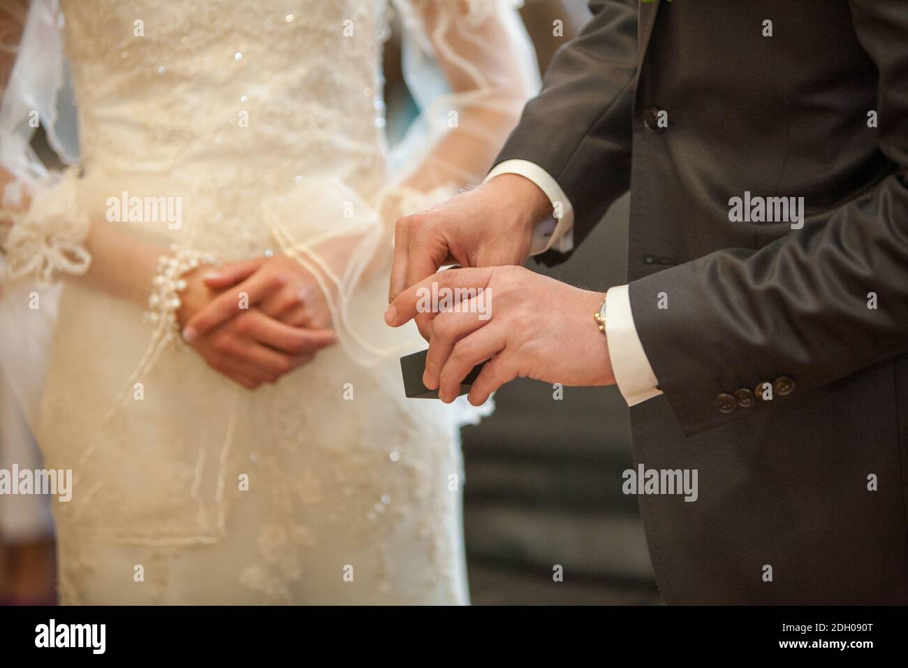 Bride and groom exchanging of the Wedding Rings Stock Photo