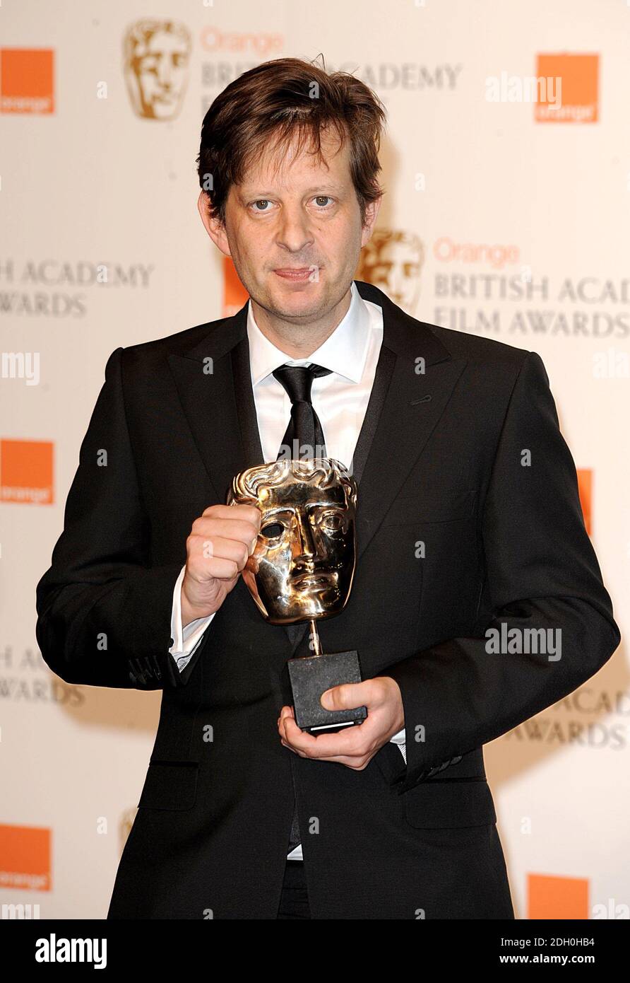 Christian Colson with the Best Film award received for Slumdog Millionaire at the 2009 British Academy Film Awards at the Royal Opera House in Covent Garden, central London. THE USE OF THIS IMAGE IS STRICTLY EMBARGOED UNTIL 21:30 GMT ON SUNDAY 8TH FEBRUARY. Stock Photo
