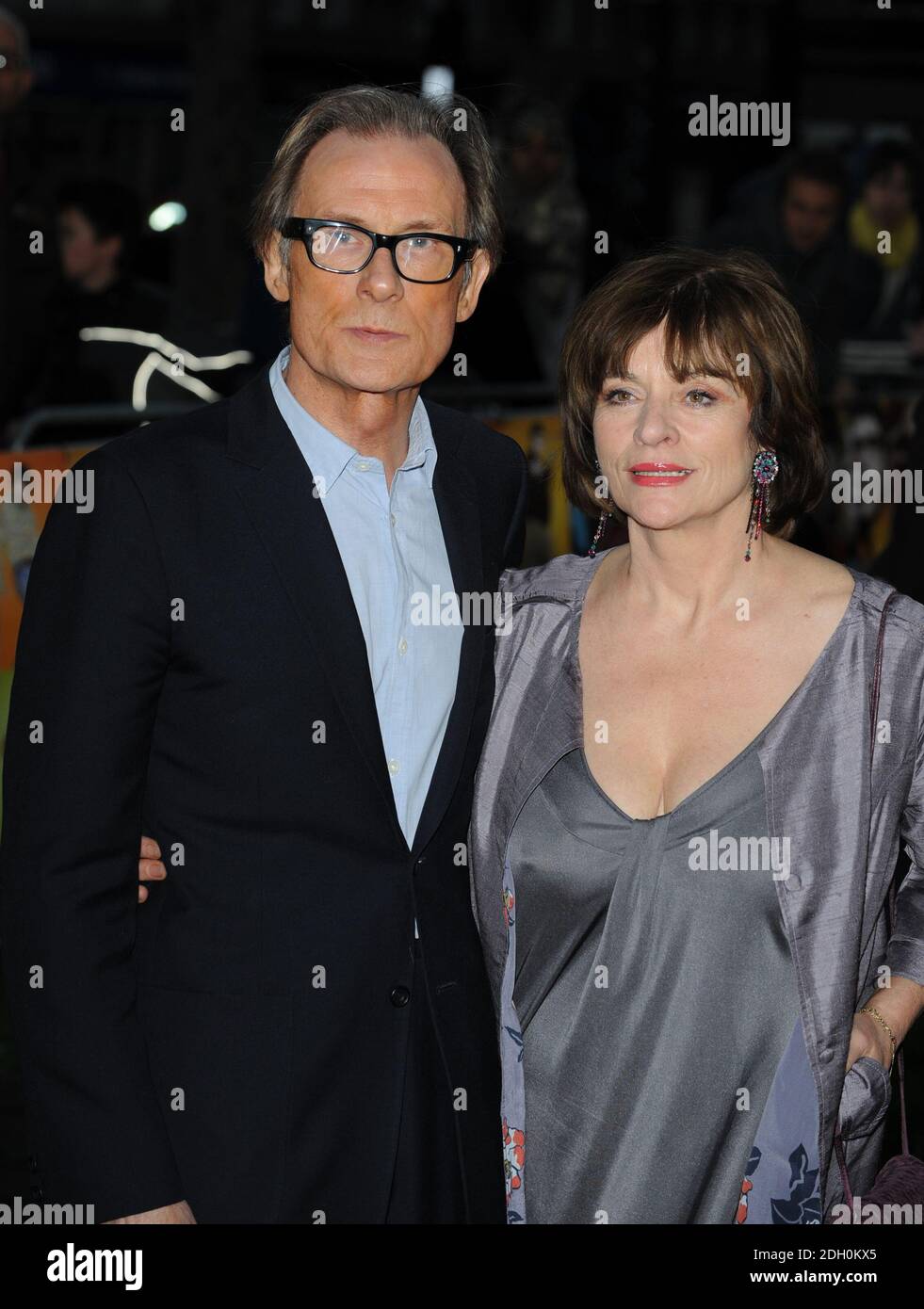 Bill Nighy and wife arriving for the premiere of The Boat That Rocked at the Odeon Leicester Square, London. Stock Photo