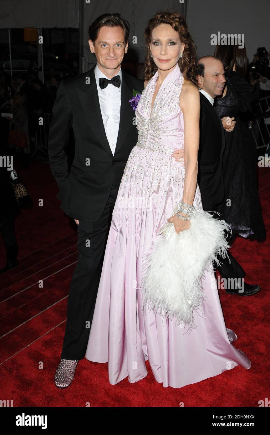 European Editor at Large for Vogue Hamish Bowles (L) and actress Marisa Berenson arriving at the Model as Muse, Embodying Fashion, Costume Institute Gala, the Metropolitan Museum, New York, USA Stock Photo