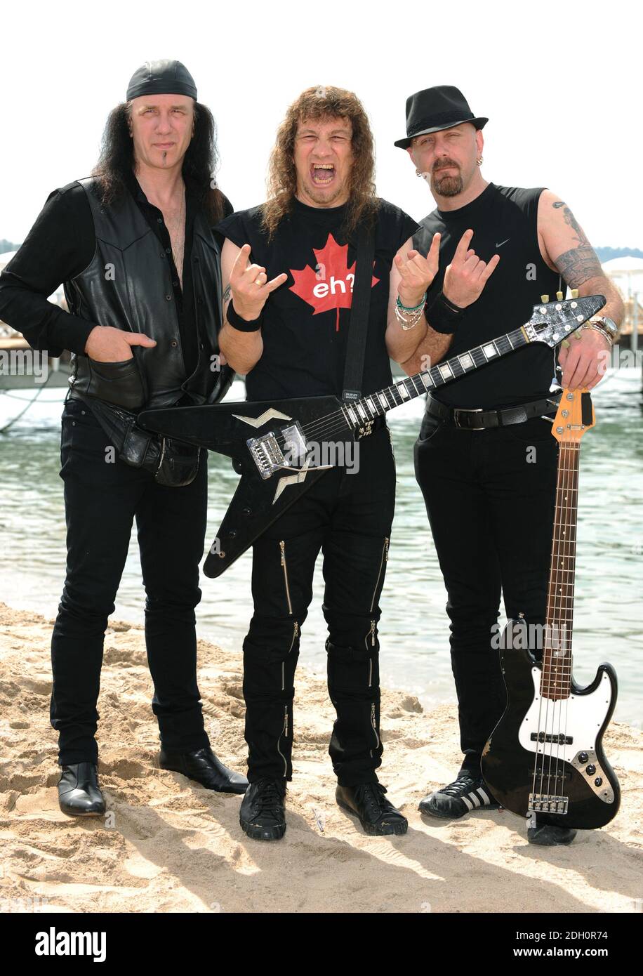 From the left Canadian musicians Robb Reiner , Steve Kudlow, and G5 at the photocall for Anvil The Story of Anvil, held on Nikki Beach, Cannes. Part of the 62nd Festival de Film, Cannes. Stock Photo