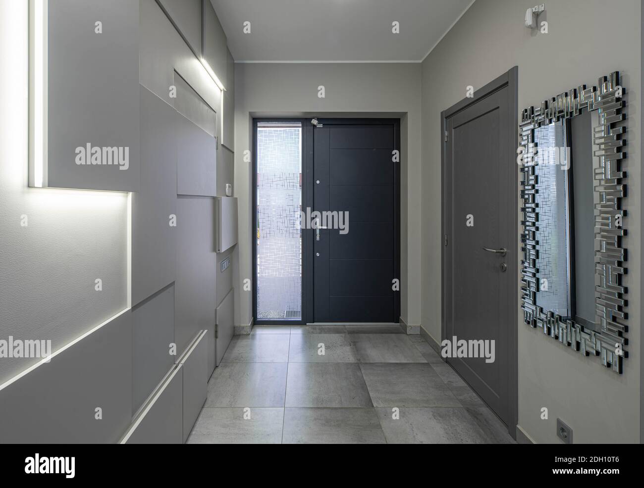 Contemporary interior of entrance hall in luxury apartment. Modern ...