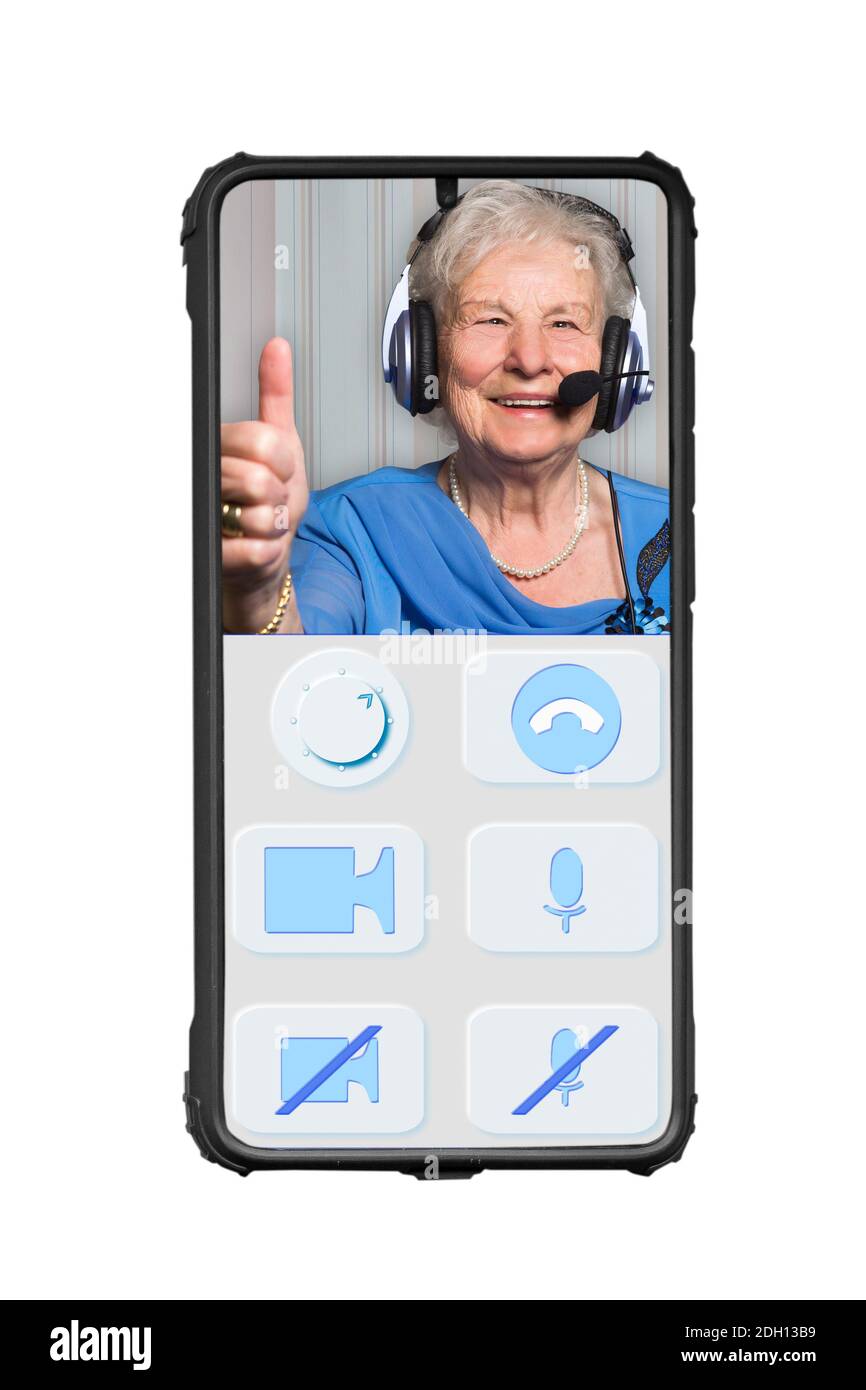 Isolated smartphone shows an imaginary designed app for video calls of elderly people. The buttons are large and clear. On the screen is a cheerful se Stock Photo