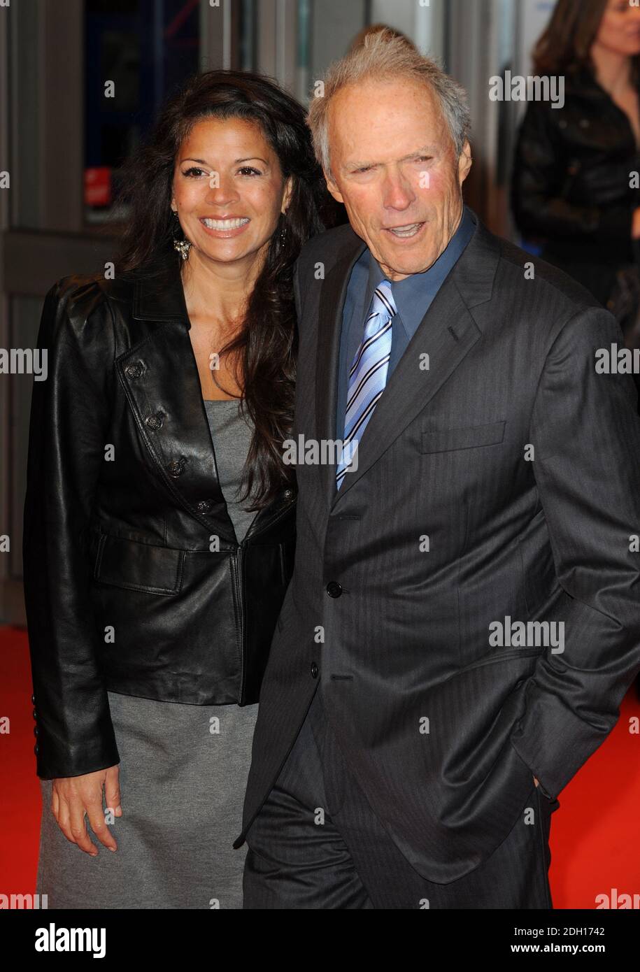 Clint Eastwood and Dina Ruiz arriving at the UK Premiere of Invictus