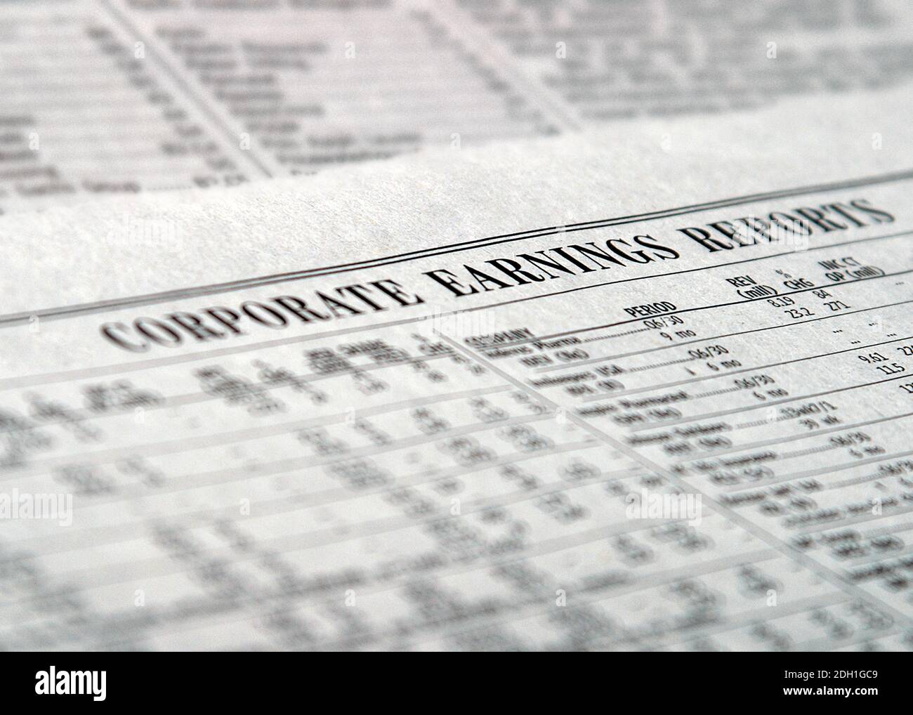 Businesses report their corporate earnings in the financial pages of popular newspapers. Stock market investors read about profit, gains and losses. Stock Photo