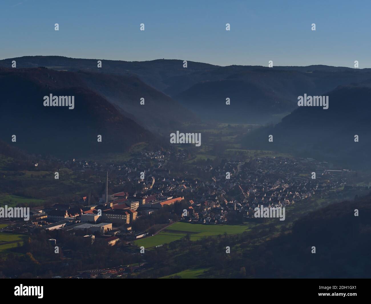 Beautiful aerial panoramic view of small town Lenningen, Baden-Wuerttemberg, Germany located in valley on the foothills of Swabian Alb with buildings. Stock Photo