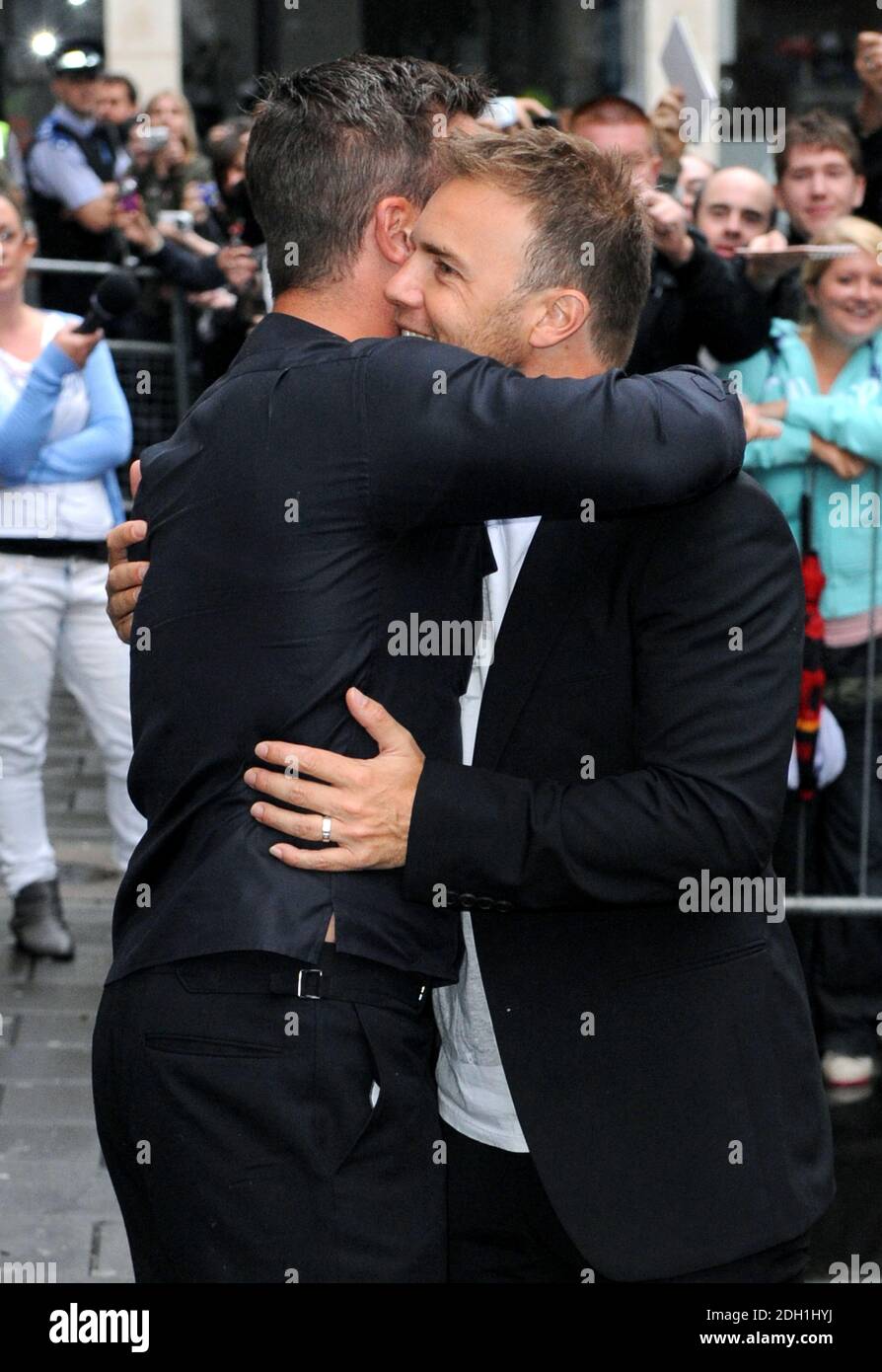 Gary Barlow and Robbie Williams arriving at Radio 1 to promote their new duet 'Shame', London