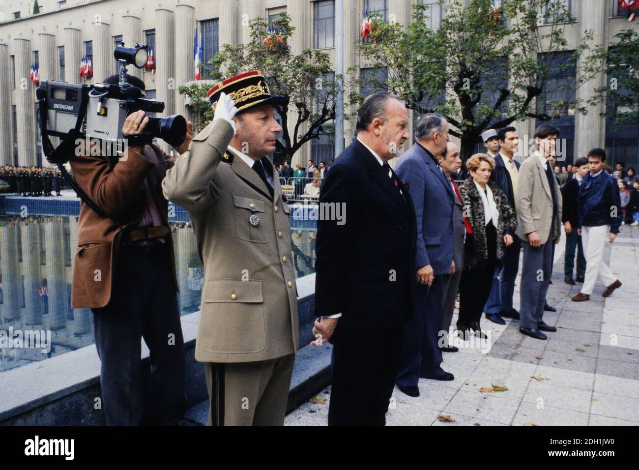 Charles Hernu attends military ceremony, Villeurbanne, France Stock