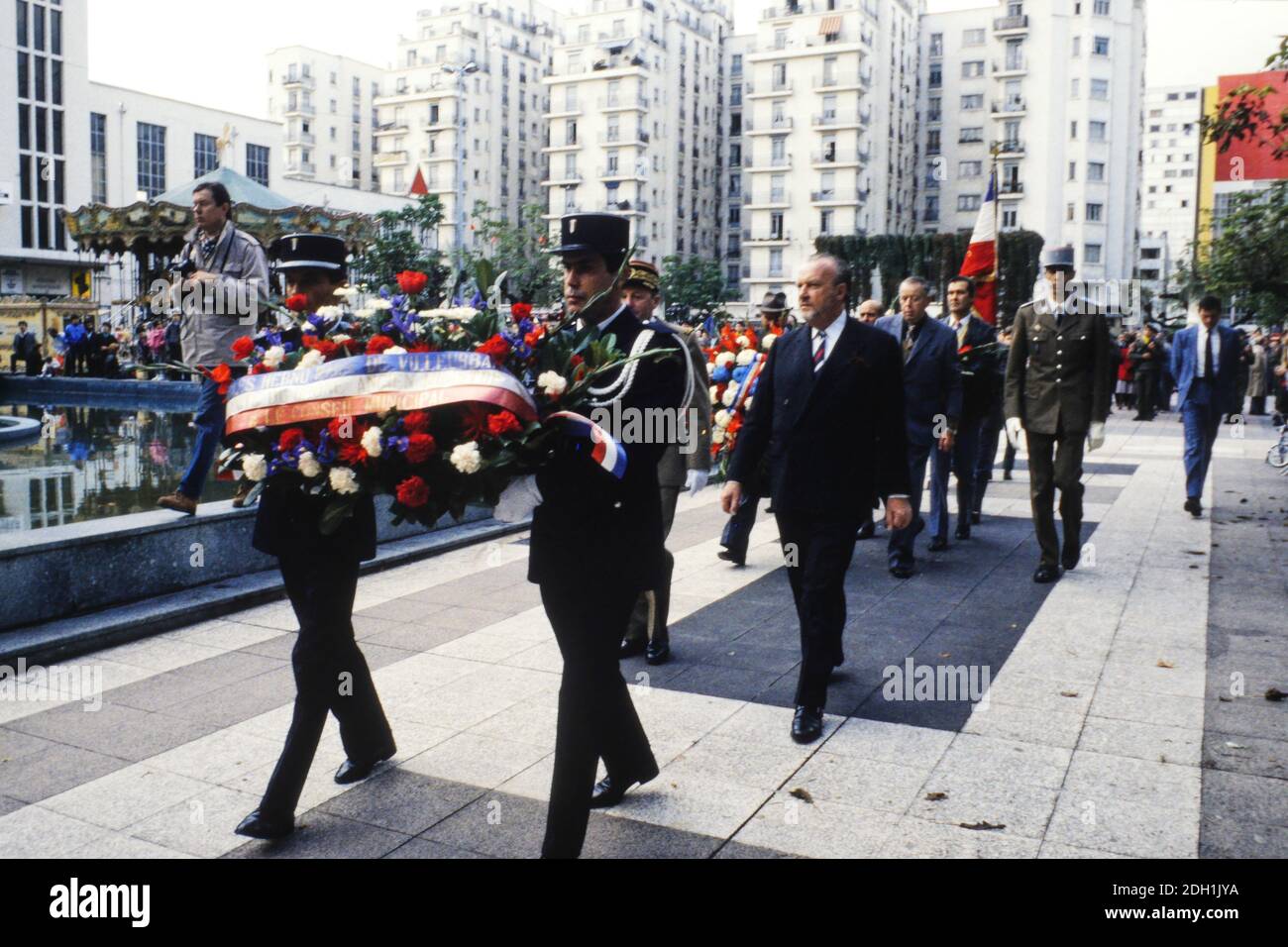 Charles Hernu attends military ceremony, Villeurbanne, France Stock