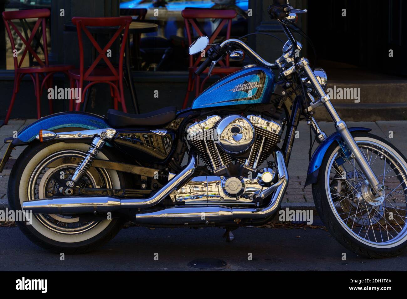 Light blue Harley Davidson with sparkling chrome, exhaust pipes and