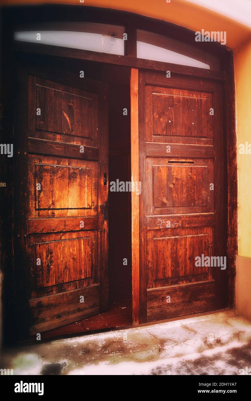 partially opened wooden double door Stock Photo