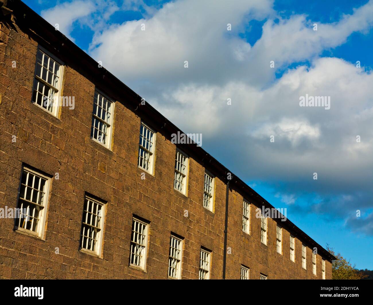 Factory buildings at Cromford Mill the world's first water powered cotton mill built by Richard Arkwright in 1771 in Cromford Derbyshire England UK Stock Photo