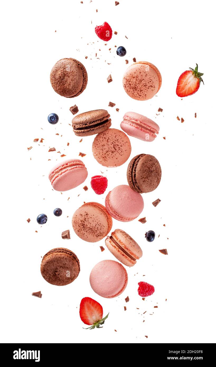 Flying or falling macarons, isolated on white Stock Photo