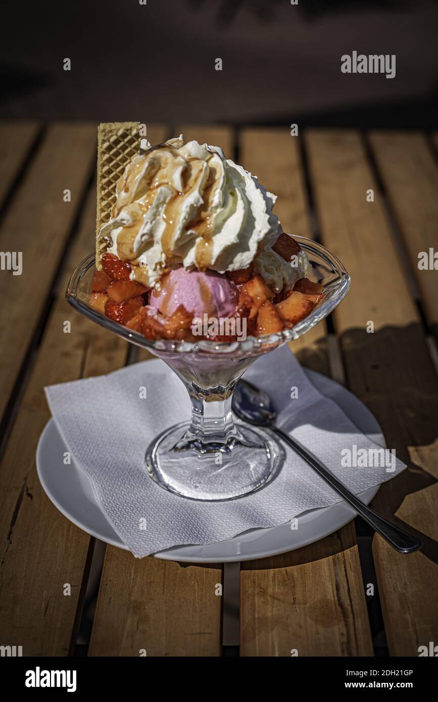 Strawberry sundae with cream in summer Stock Photo