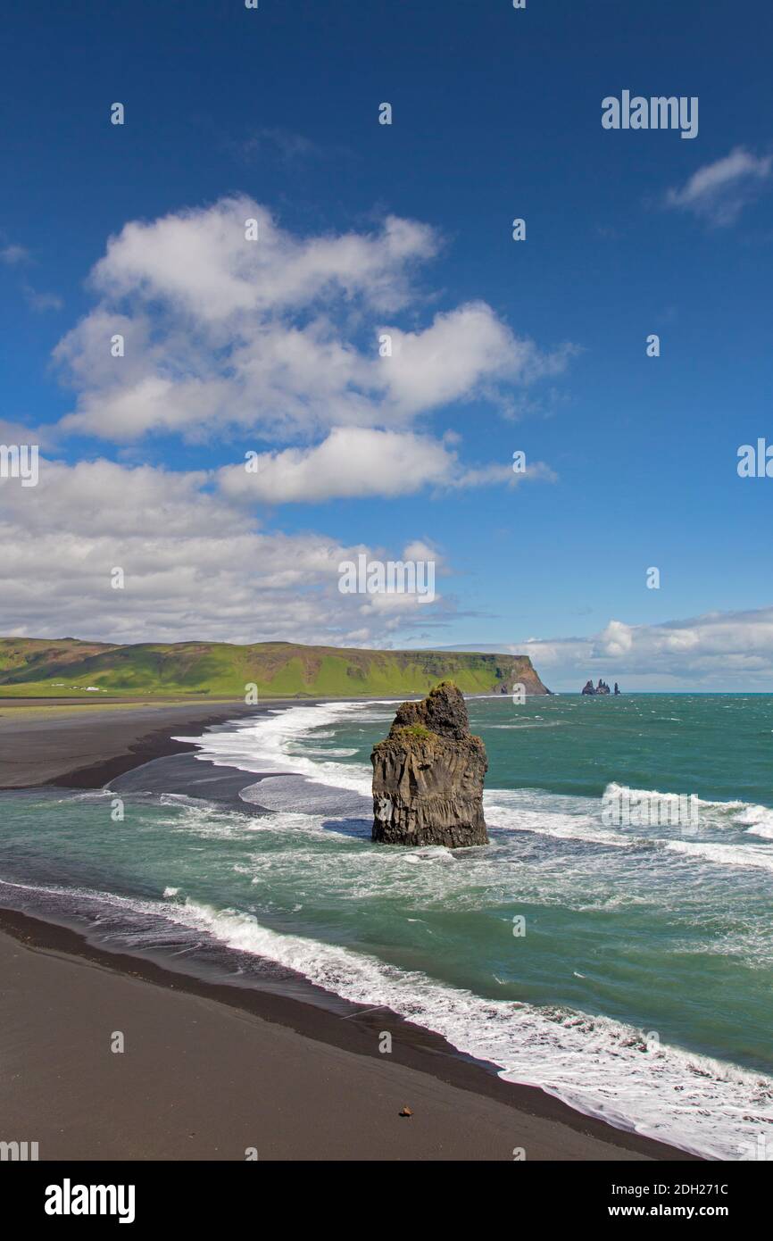 Arnardrangur / Eagle rock, basalt sea stack on the Black sand beach Reynisfjara near Vík í Mýrdal in summer, Iceland Stock Photo