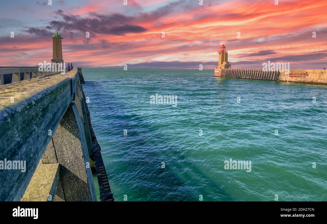 Lighthouses and guidance at sunset at the entrance of the Port of Fecamp Stock Photo