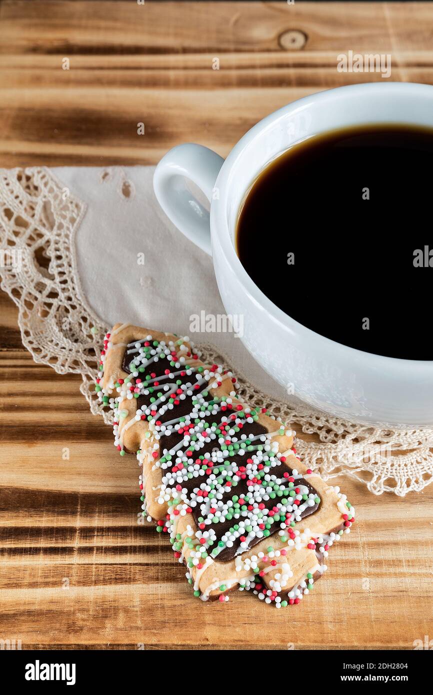 Cup of coffee with christmas tree cookies Stock Photo