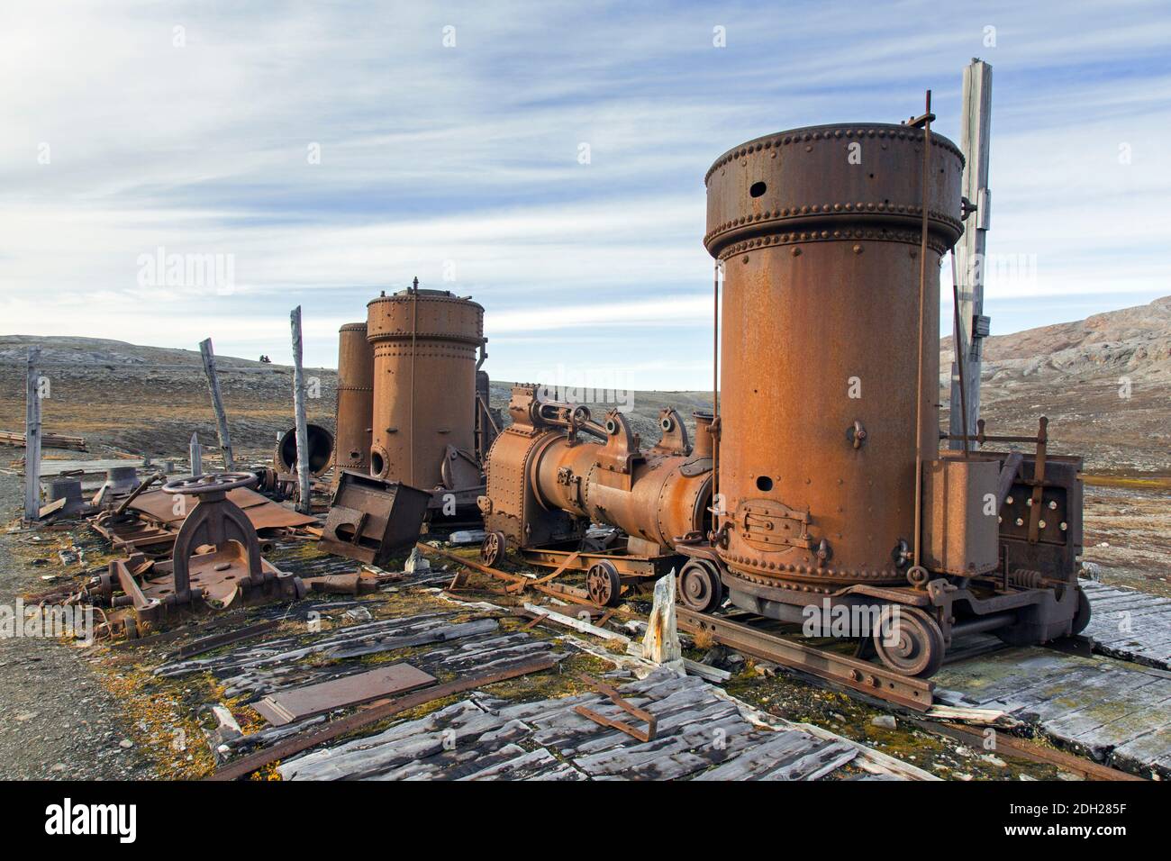 Steam boilers at abandoned marble quarry Camp Mansfield / Ny London near Ny-Alesund, Blomstrandhalvøya, Kongsfjorden, Svalbard / Spitsbergen, Norway Stock Photo