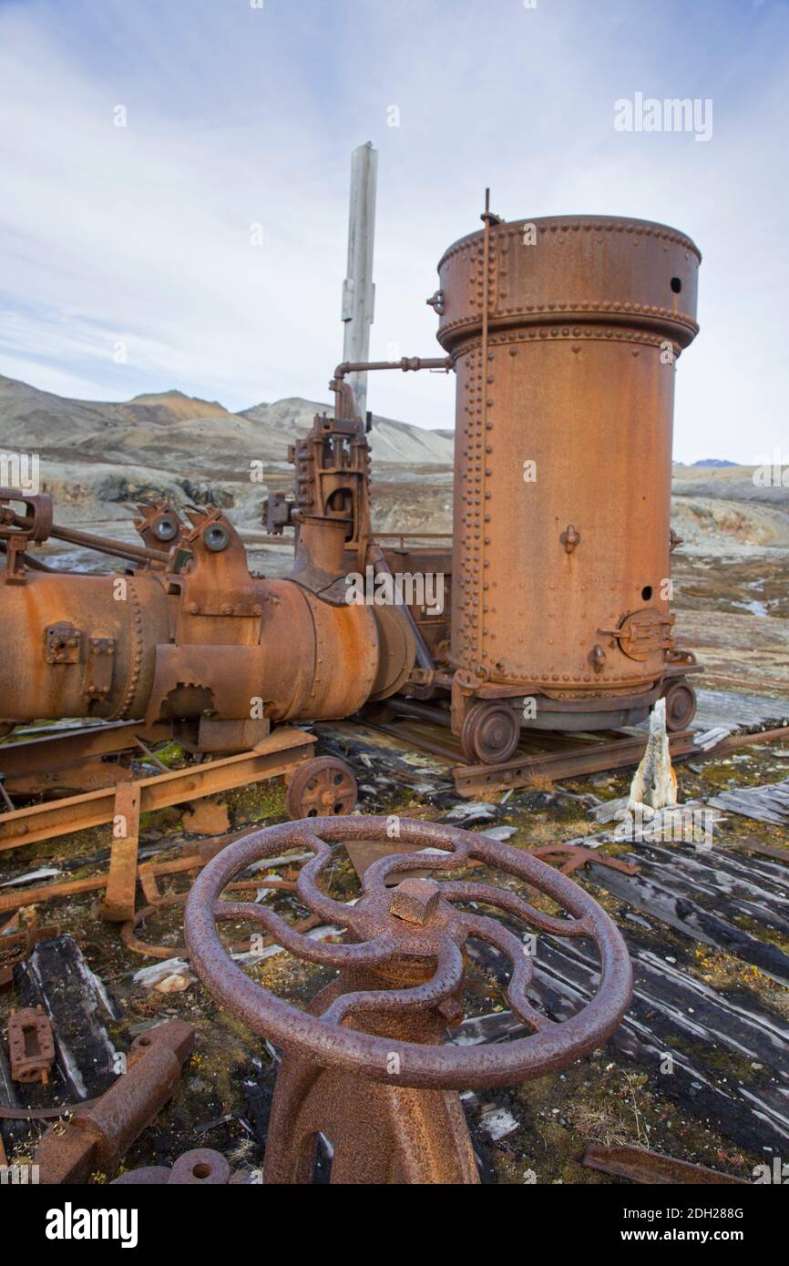 Steam boilers at abandoned marble quarry Camp Mansfield / Ny London near Ny-Alesund, Blomstrandhalvøya, Kongsfjorden, Svalbard / Spitsbergen, Norway Stock Photo