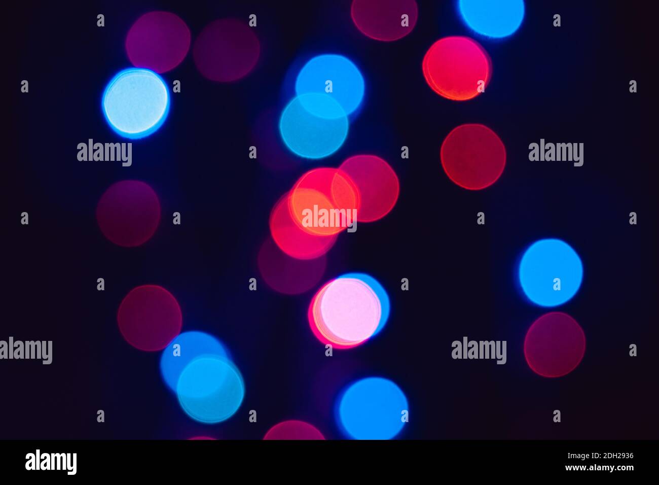 Red blue and purple bokeh dots on black background, colorful circles to use for photo image manipulation Stock Photo